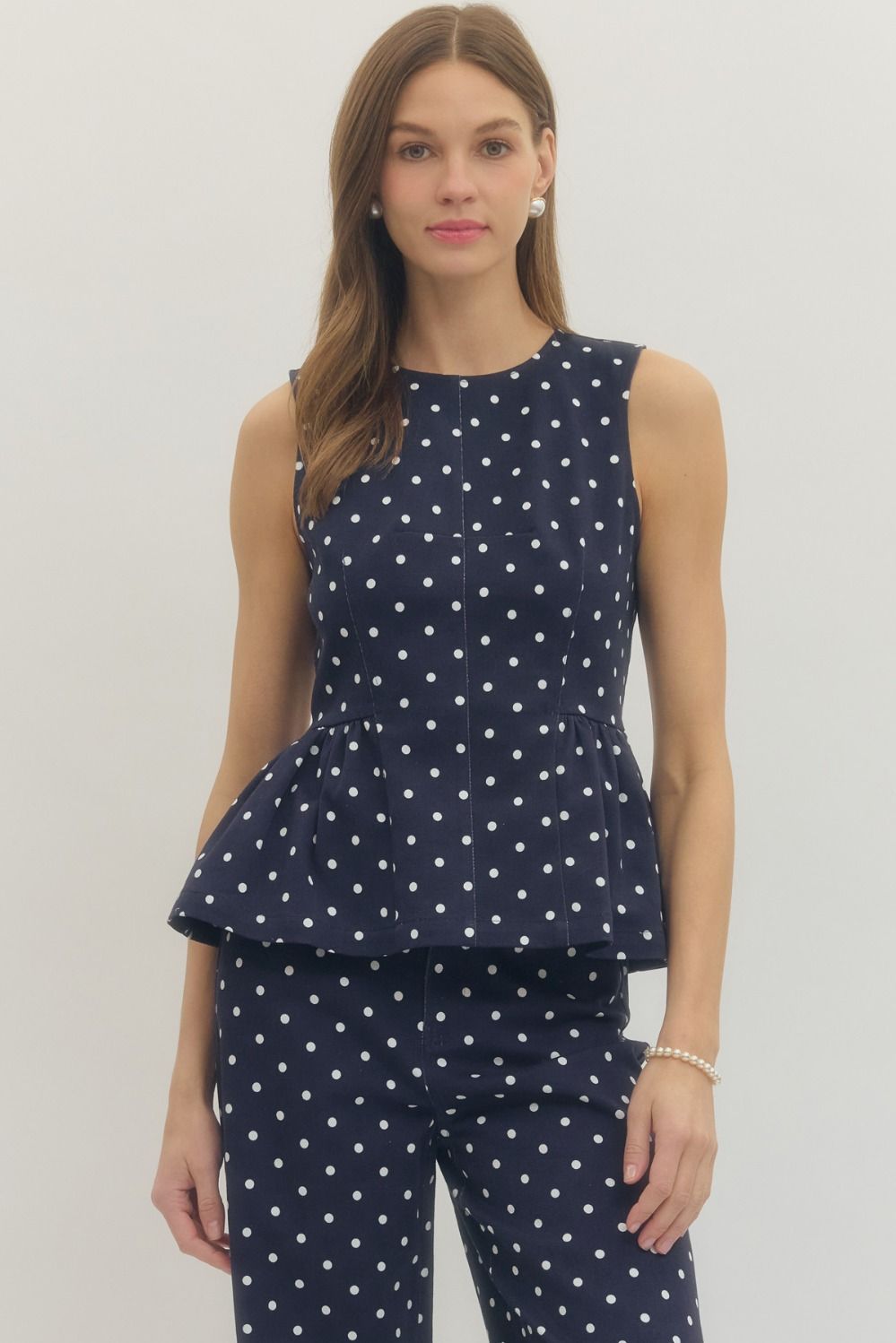 Navy Polka Dot Sleeveless Peplum Top